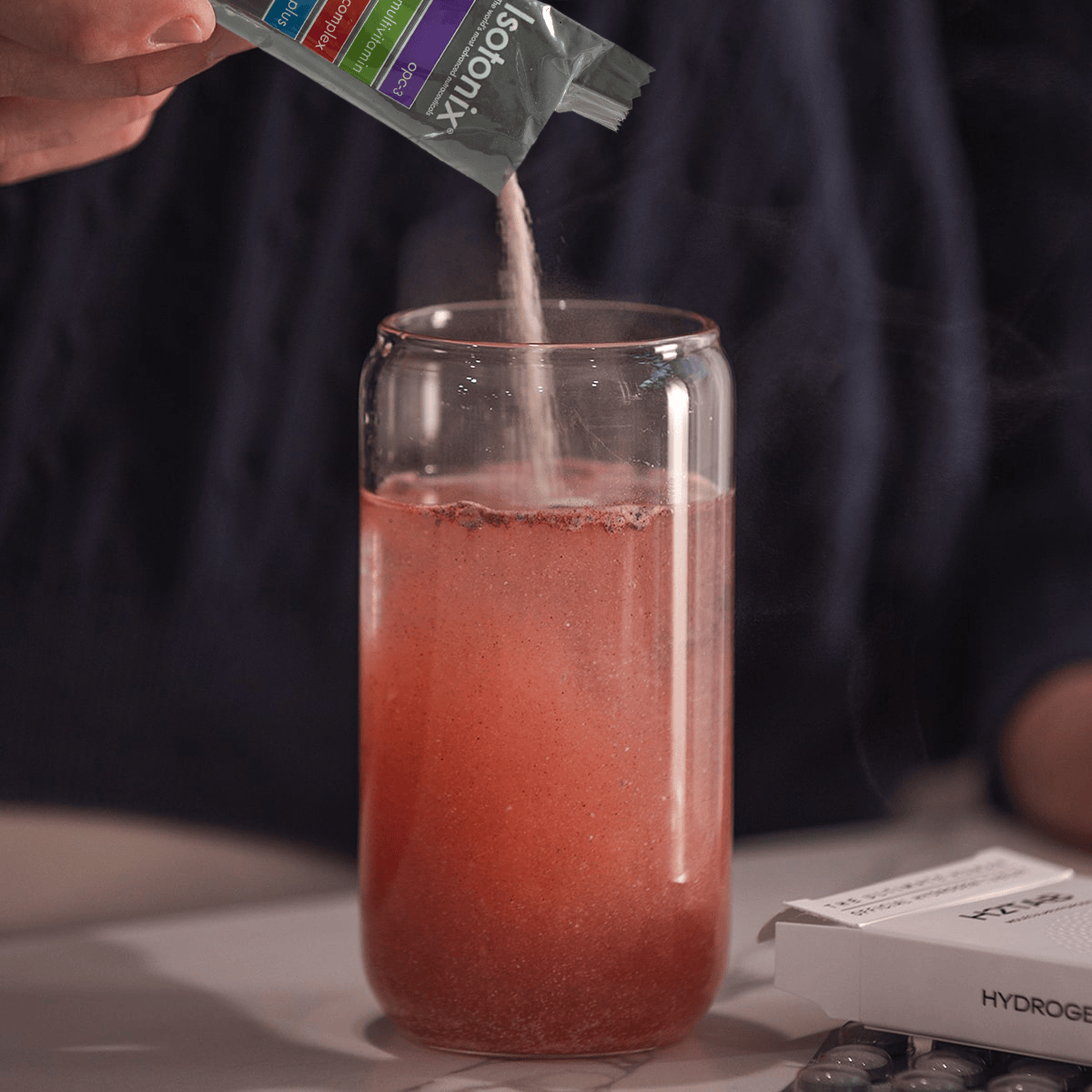 image of Isotonix Daily Essentials Packet being added to water
