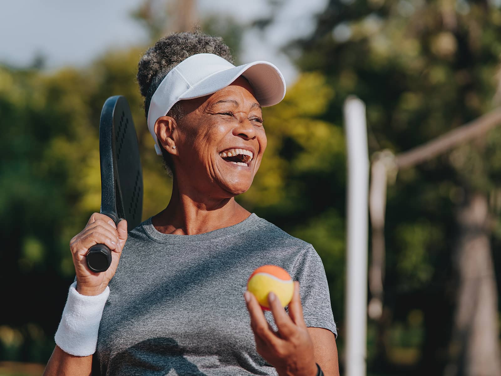 image of person holding a tennis ball