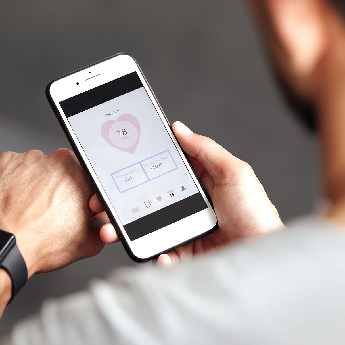 image of a person looking at their vital signs