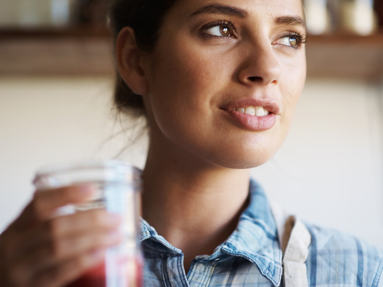 image of a woman holding a glass