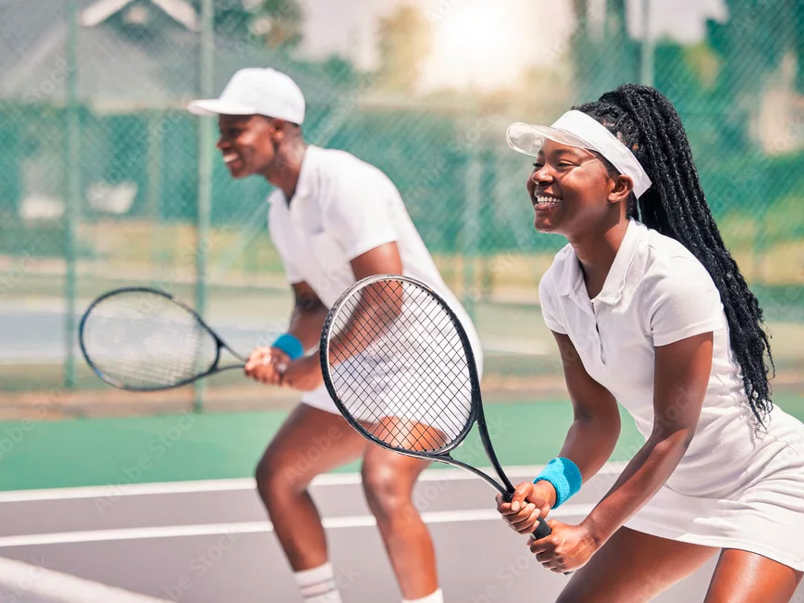 image of a couple playing tennis