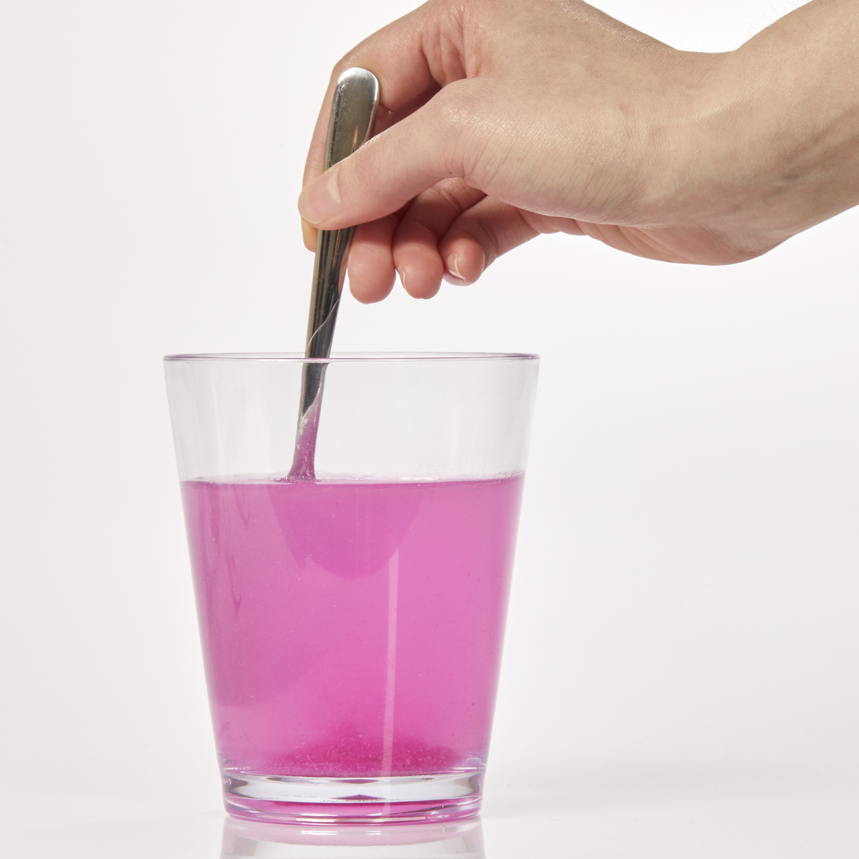 image of person stirring with a spoon