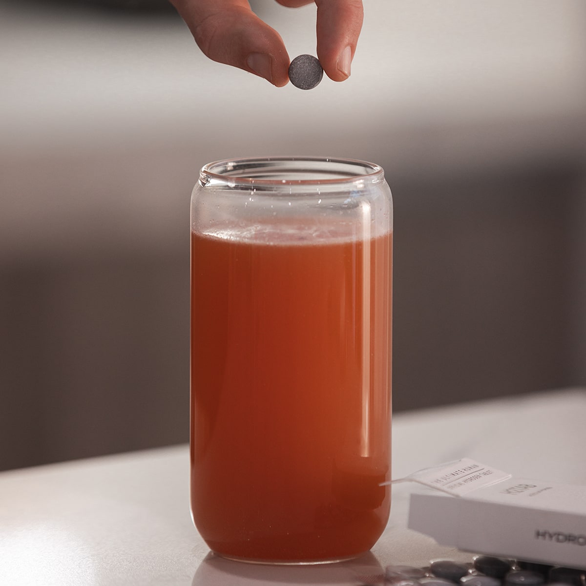 image of tablet being dropped into Isotonix Daily Essentials
