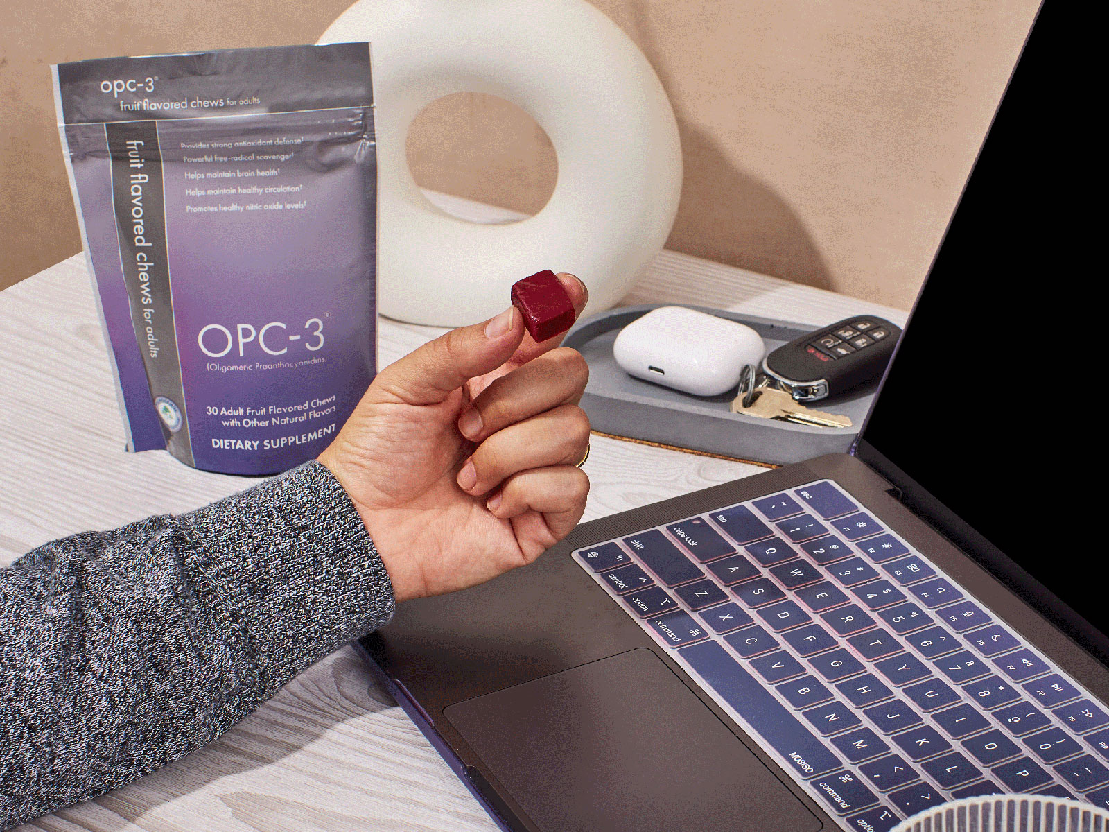 image of person holding an OPC-3 Chew while working at desk