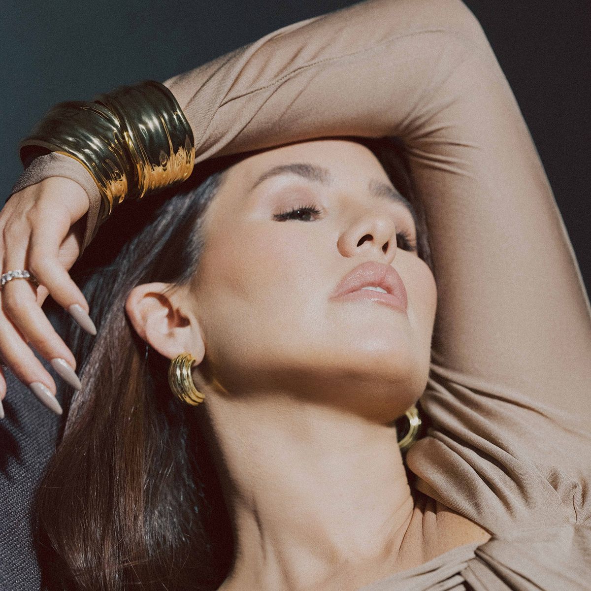 Amber wearing layered jewelry