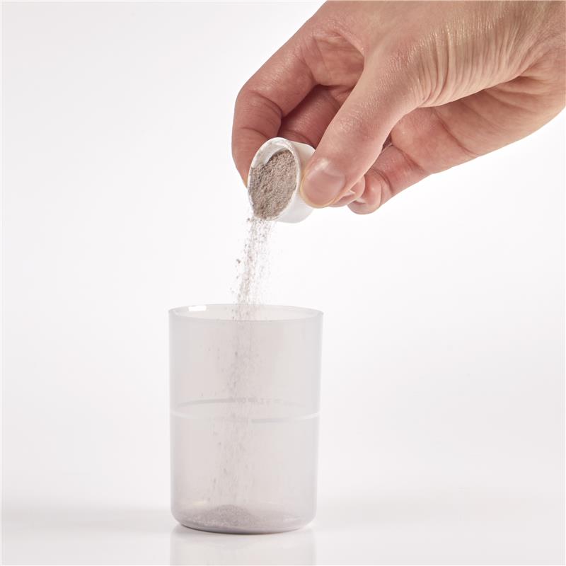 Show capful of Isotonix powder being poured into overcap