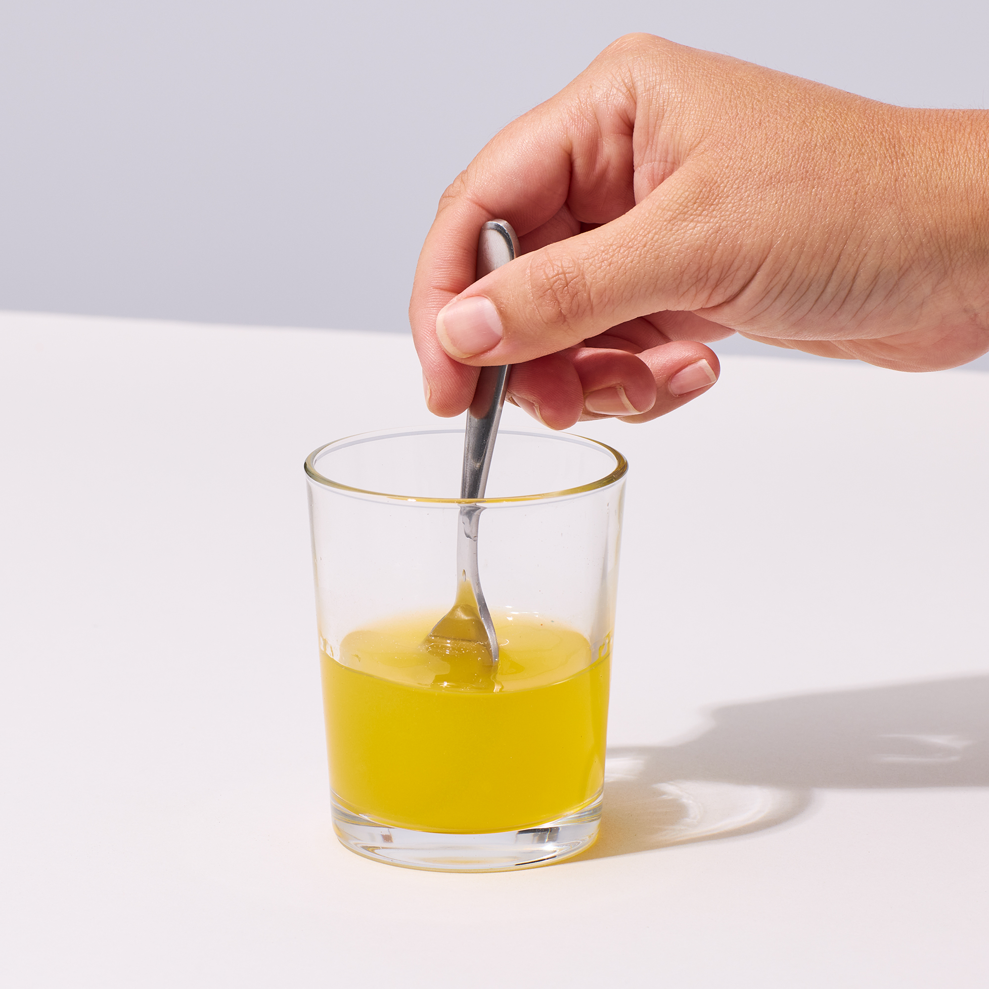 image of person mixing up Prime Joint powder into water