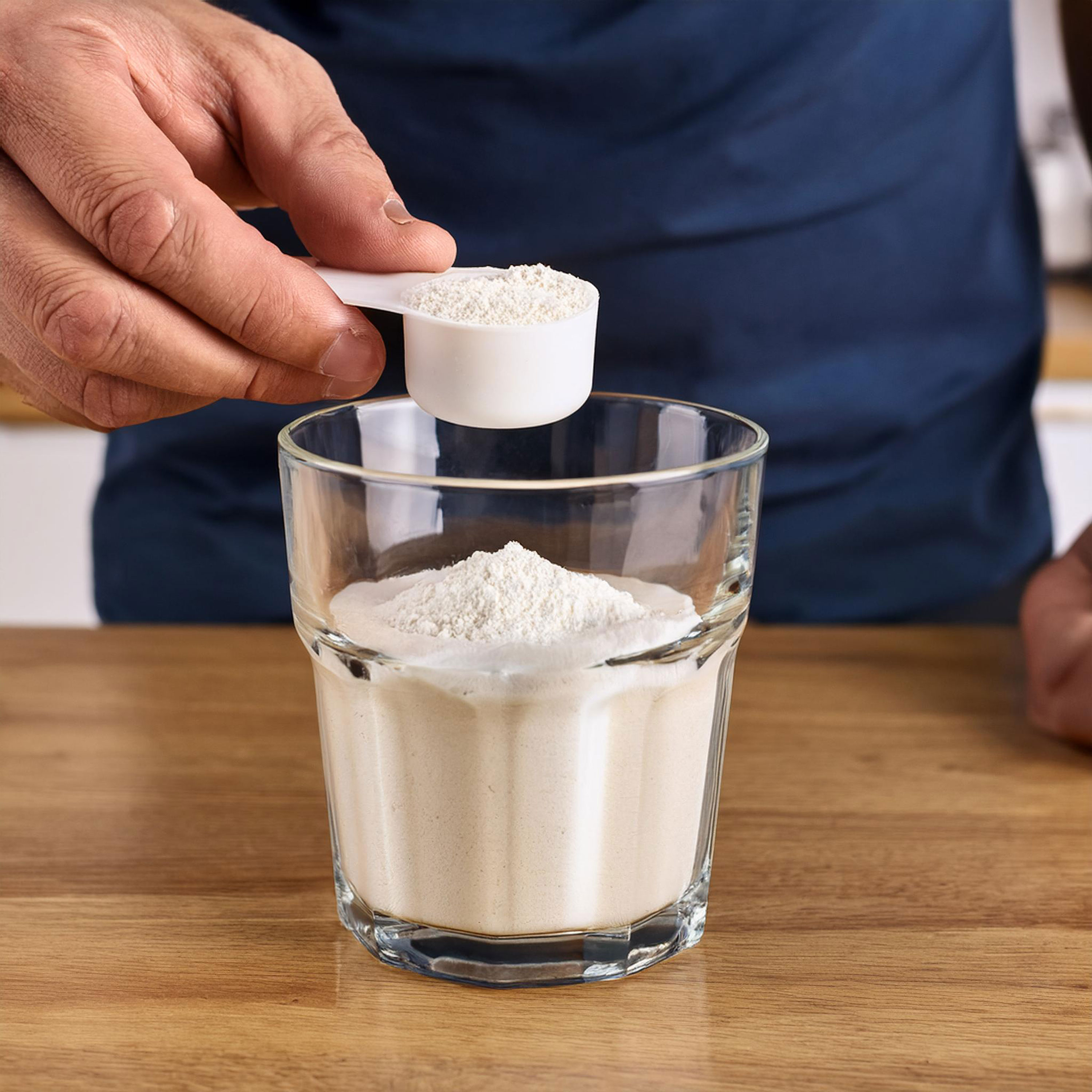 image of person adding powder to water