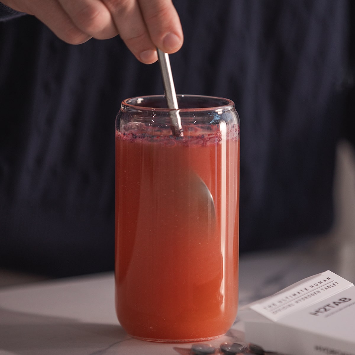 image of powder being stirred into water