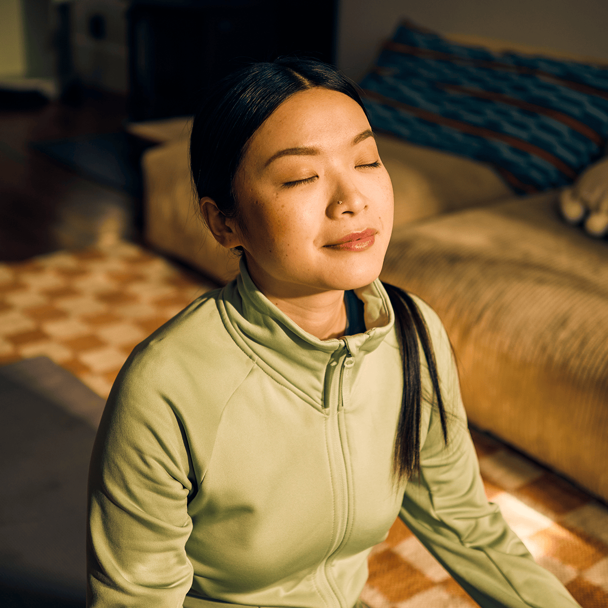 Woman sitting on the edge of a bed