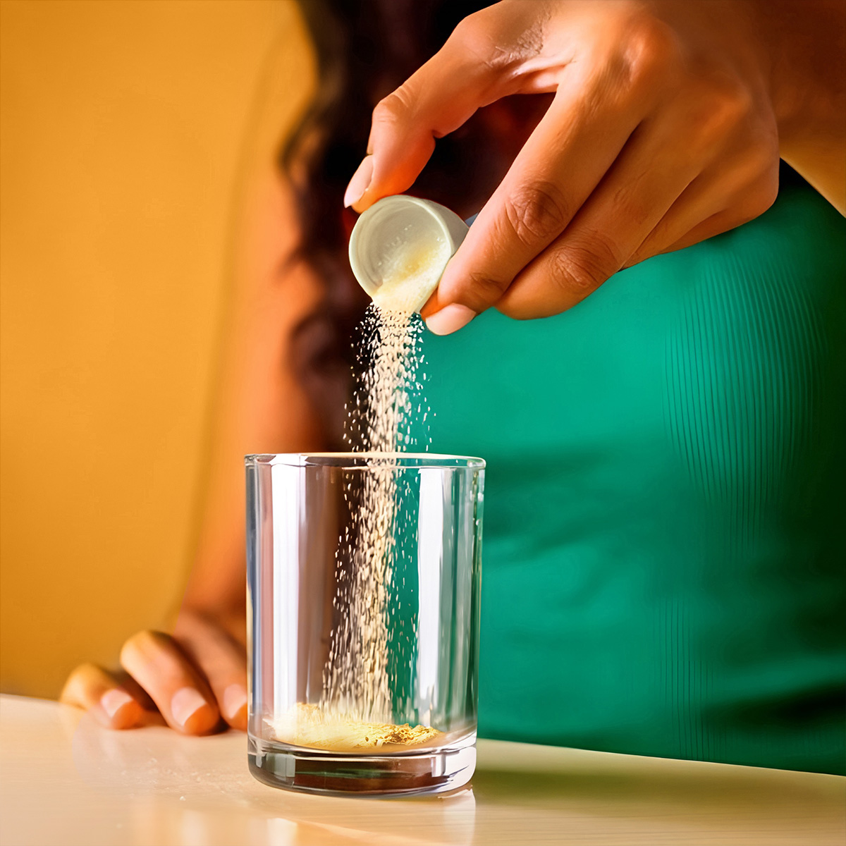 image of powder being poured into glass