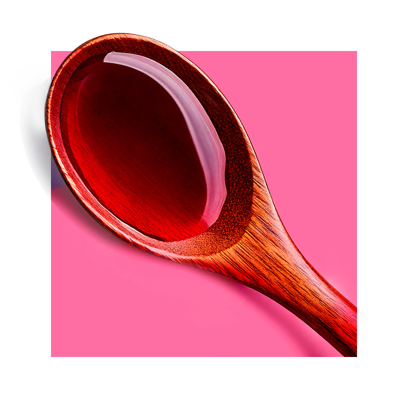 image of wooden spoon containing red wine