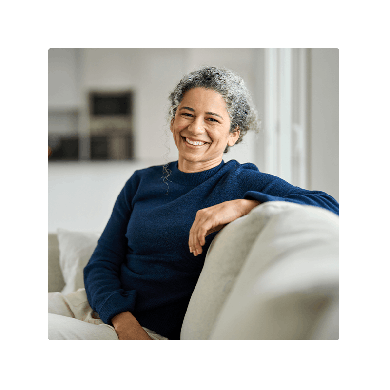 a healthy older person sitting on a couch
