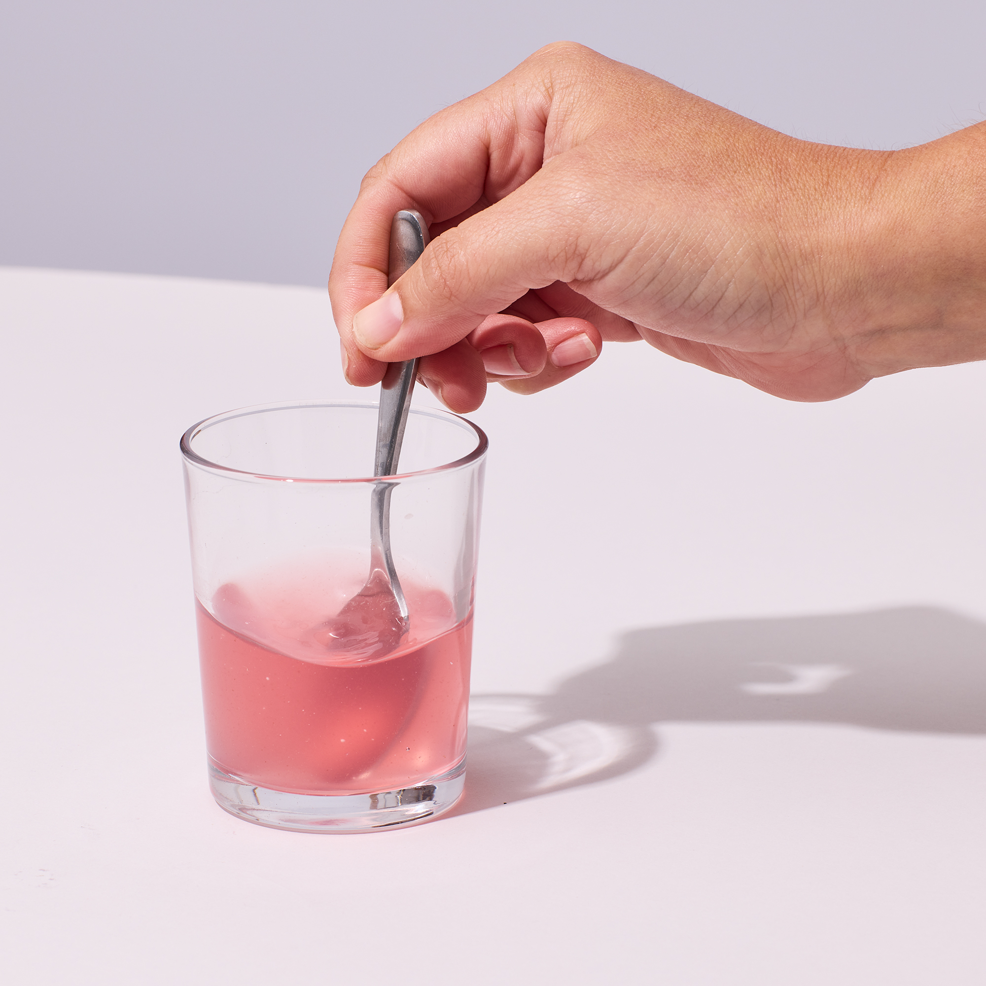 image of person mixing powder and water