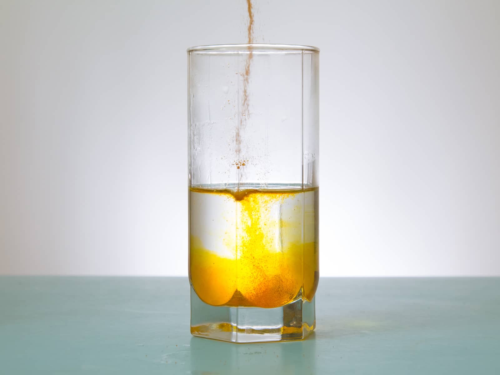 image of liquid being poured into a glass