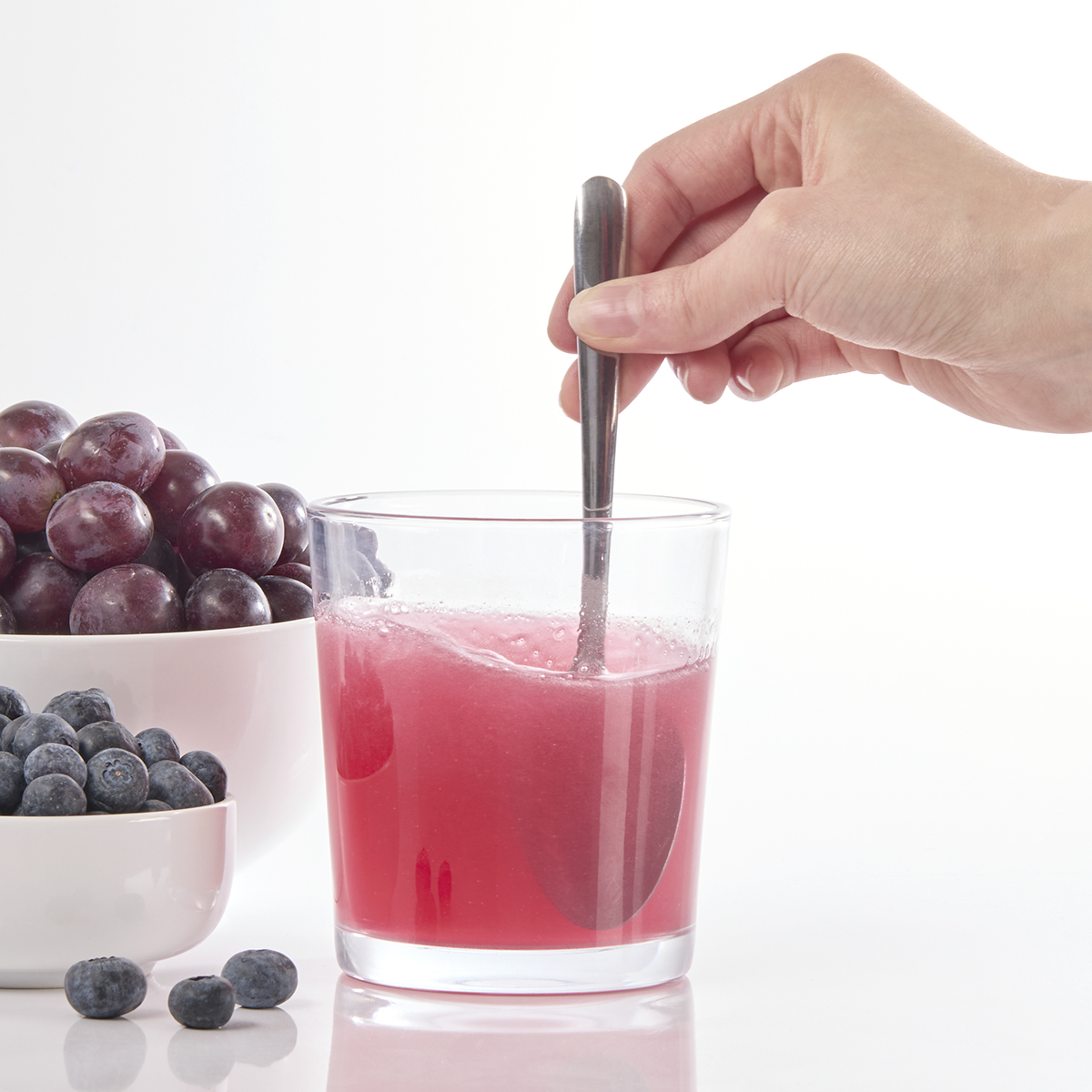 image of powder and water mixed in overcap