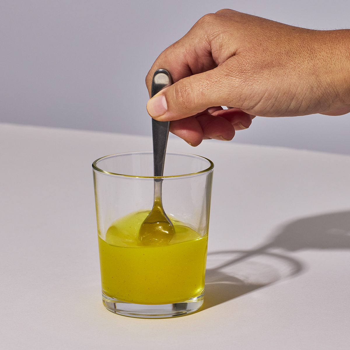 image of person mixing powder and water